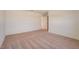 Spacious bedroom featuring neutral carpeting and a doorway to another room at 3565 Dahlia Dr, Lake Hamilton, FL 33851