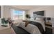 A serene bedroom features a large window, a comfortable bed, and soft lighting at 3565 Dahlia Dr, Lake Hamilton, FL 33851