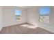 Sun-filled bedroom with plush carpeting and natural light from windows at 3565 Dahlia Dr, Lake Hamilton, FL 33851
