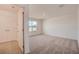 Bright bedroom featuring neutral carpeting, a double door closet and a window at 3565 Dahlia Dr, Lake Hamilton, FL 33851