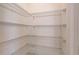 Walk-in closet with adjustable metal shelving at 3565 Dahlia Dr, Lake Hamilton, FL 33851