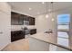 Modern kitchen with stainless steel appliances, granite countertops, and dark wood cabinets at 3565 Dahlia Dr, Lake Hamilton, FL 33851