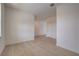 Tiled living area with neutral walls and access to hallways at 3565 Dahlia Dr, Lake Hamilton, FL 33851