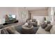 A cozy loft with comfortable seating, a large television, and an inviting atmosphere at 3565 Dahlia Dr, Lake Hamilton, FL 33851