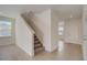 Entryway to carpeted staircase with tile floors in the living room at 3565 Dahlia Dr, Lake Hamilton, FL 33851