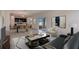 Open concept living room and kitchen with tile flooring and stainless steel appliances at 3565 Dahlia Dr, Lake Hamilton, FL 33851