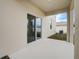 Covered patio with sliding glass doors offers seamless indoor-outdoor living at 3565 Dahlia Dr, Lake Hamilton, FL 33851