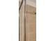 Close-up of shower with chrome frame and neutral toned tiling at 3565 Dahlia Dr, Lake Hamilton, FL 33851