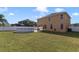 Spacious backyard with well-maintained lawn, an above-ground pool, and privacy fencing at 3680 Ricky Ln, St Cloud, FL 34772