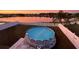Backyard with Above ground pool and lake views at 3680 Ricky Ln, St Cloud, FL 34772