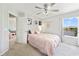 This bedroom features calming decor, lots of natural light, and a water view at 3680 Ricky Ln, St Cloud, FL 34772
