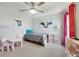 This bedroom features fun decor, lots of natural light, and carpet flooring at 3680 Ricky Ln, St Cloud, FL 34772