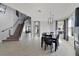Spacious dining room with staircase and modern lighting at 3680 Ricky Ln, St Cloud, FL 34772