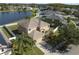 Charming two-story home with attached garage, well-maintained lawn, and white picket fence near a lake at 3680 Ricky Ln, St Cloud, FL 34772