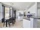 Open concept kitchen with stainless steel appliances and adjacent dining area at 3680 Ricky Ln, St Cloud, FL 34772