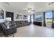 This living room features tile floors, lots of natural light, and an inviting seating area at 3680 Ricky Ln, St Cloud, FL 34772