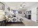This main bedroom offers a cozy atmosphere with unique decor and plenty of natural light at 3680 Ricky Ln, St Cloud, FL 34772