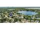 Aerial view of a neighborhood near a lake in a scenic and wooded area at 4021 Hargill Dr, Orlando, FL 32806