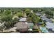 Aerial view of a home with a pool, a screened enclosure, and a fenced yard at 4021 Hargill Dr, Orlando, FL 32806