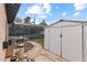 Backyard featuring a screened-in pool, storage shed, and well-maintained pool equipment for convenient maintenance at 4021 Hargill Dr, Orlando, FL 32806