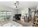 Bedroom featuring desk, ceiling fan, sliding door access to porch and an ensuite bathroom at 4021 Hargill Dr, Orlando, FL 32806