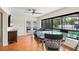 Bright dining area with a view of the screened-in pool area through large glass doors and a ceiling fan at 4021 Hargill Dr, Orlando, FL 32806