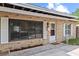 Exterior front view showing brick facade, well-maintained landscaping, and charming entry door at 4021 Hargill Dr, Orlando, FL 32806