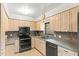 Bright kitchen with stainless steel appliances, granite countertops, and neutral cabinetry at 4021 Hargill Dr, Orlando, FL 32806