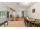 Open-concept living space featuring tile and hardwood floors, natural light, and neutral décor at 4021 Hargill Dr, Orlando, FL 32806