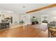 Bright living room with hardwood floors, a decorative rug, and a view to the kitchen at 4021 Hargill Dr, Orlando, FL 32806