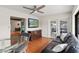 Living space featuring hardwood floors, open layout, adjacent dining area, with natural light from glass doors at 4021 Hargill Dr, Orlando, FL 32806