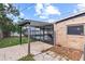 Screened-in pool area featuring a brick house and an open patio perfect for relaxing and entertaining guests at 4021 Hargill Dr, Orlando, FL 32806