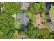 Bird's-eye view of a home nestled among lush greenery, trees and manicured lawns at 4065 Winderlakes Dr, Orlando, FL 32835