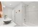 Stylish bathroom featuring unique sink, modern fixtures, and tiled shower-tub combo at 4065 Winderlakes Dr, Orlando, FL 32835