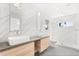 Modern bathroom with double vanity, sleek fixtures, and a glass-enclosed shower at 4065 Winderlakes Dr, Orlando, FL 32835