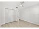 Simple bedroom with a ceiling fan and a closet, offering a cozy and functional space at 4065 Winderlakes Dr, Orlando, FL 32835