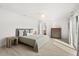 Well-lit bedroom with a plush bed, complemented by stylish furnishings and ample natural light at 4065 Winderlakes Dr, Orlando, FL 32835