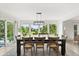 Bright dining room featuring a large table, chairs, and windows providing scenic outdoor views at 4065 Winderlakes Dr, Orlando, FL 32835