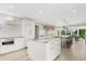 Spacious kitchen with marble island, stainless steel appliances, and modern lighting at 4065 Winderlakes Dr, Orlando, FL 32835