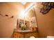 Cozy bathroom features a well-lit vanity, single sink, and stylish decor at 419 Terrace Ridge Cir # 419, Davenport, FL 33896