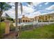 View of a community pool area with lounge chairs and umbrellas, showcasing the recreational facilities available at 419 Terrace Ridge Cir # 419, Davenport, FL 33896