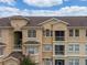 Detailed shot of a building's exterior displaying the windows, balconies, and architectural details of the property at 419 Terrace Ridge Cir # 419, Davenport, FL 33896