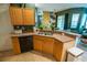 Eat-in kitchen and living space with wood cabinets at 419 Terrace Ridge Cir # 419, Davenport, FL 33896