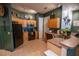 Spacious kitchen featuring a black refrigerator and modern appliances at 419 Terrace Ridge Cir # 419, Davenport, FL 33896
