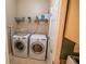 Laundry room with washer, dryer, and storage shelf at 419 Terrace Ridge Cir # 419, Davenport, FL 33896