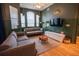Living room with hardwood flooring and mounted television at 419 Terrace Ridge Cir # 419, Davenport, FL 33896