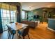 Open-concept living area with modern decor, including a comfortable gray sofa and a sliding glass door to the balcony at 419 Terrace Ridge Cir # 419, Davenport, FL 33896