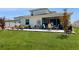 Relaxing backyard with a patio, well-maintained lawn, and white home exterior at 4191 Holstein St, St Cloud, FL 34772