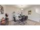 Elegant dining room featuring a glass table, modern decor, and stylish furnishings at 4191 Holstein St, St Cloud, FL 34772