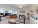 Open dining space with view to the living room, complemented by sleek, contemporary decor at 4191 Holstein St, St Cloud, FL 34772